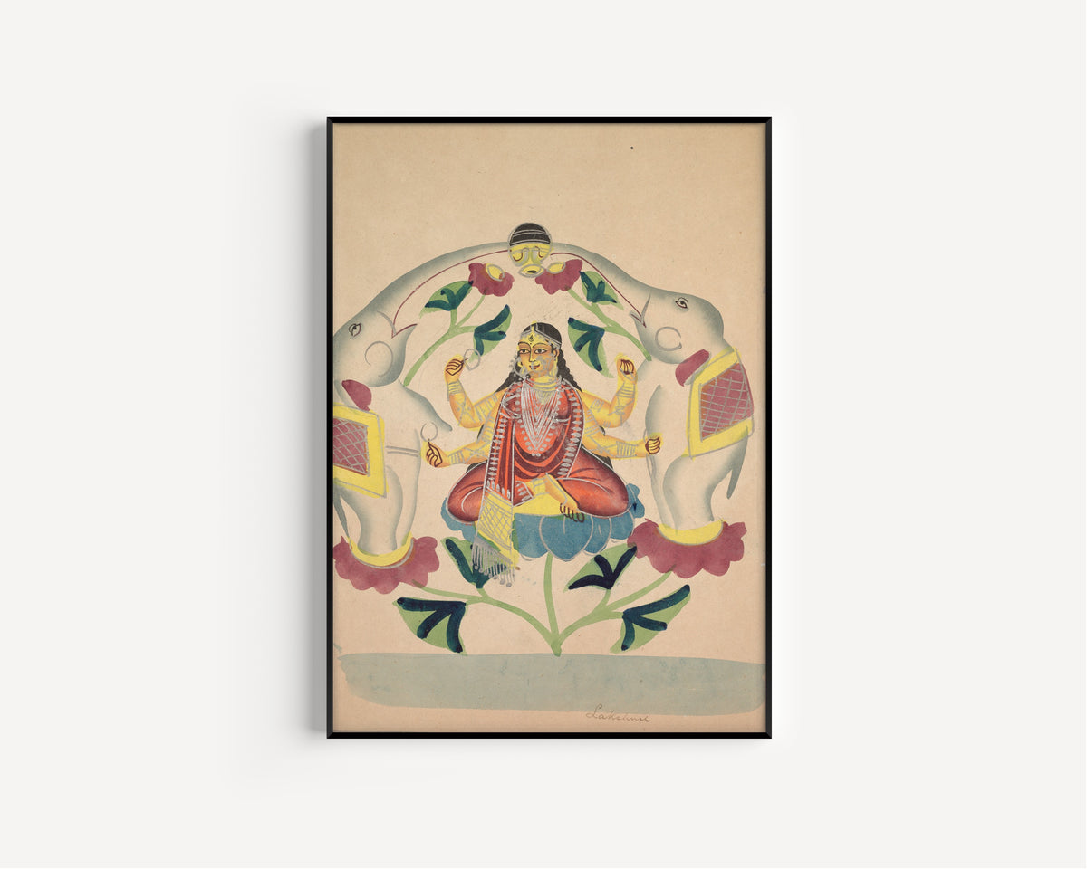 Framed art print of Gajalakshmi: Lakshmi with Elephants by Kalighat painter, in a slim black frame on a plain white wall