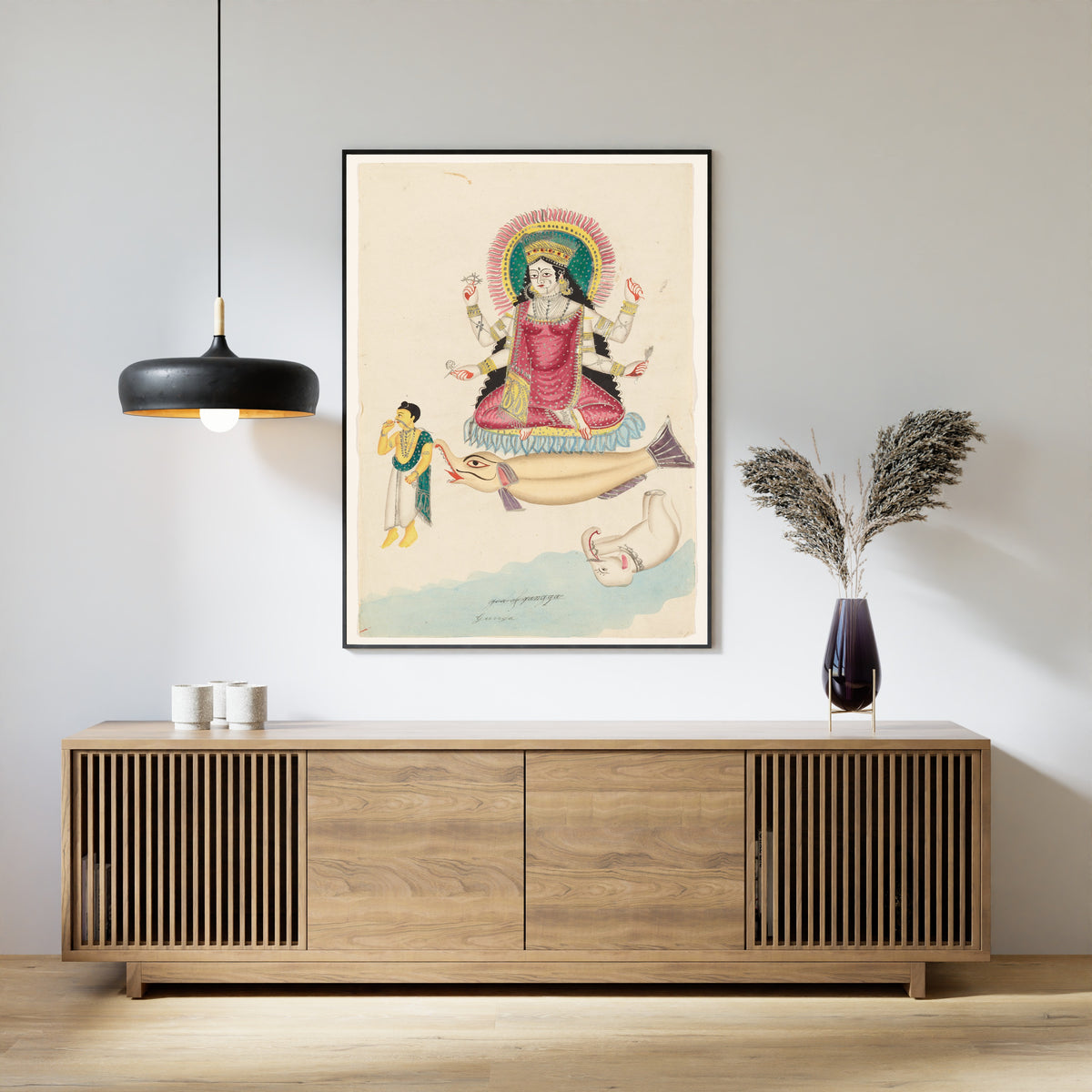 Framed art print of Ganga on a Crocodile by Kalighat painter, above a slatted wood sideboard