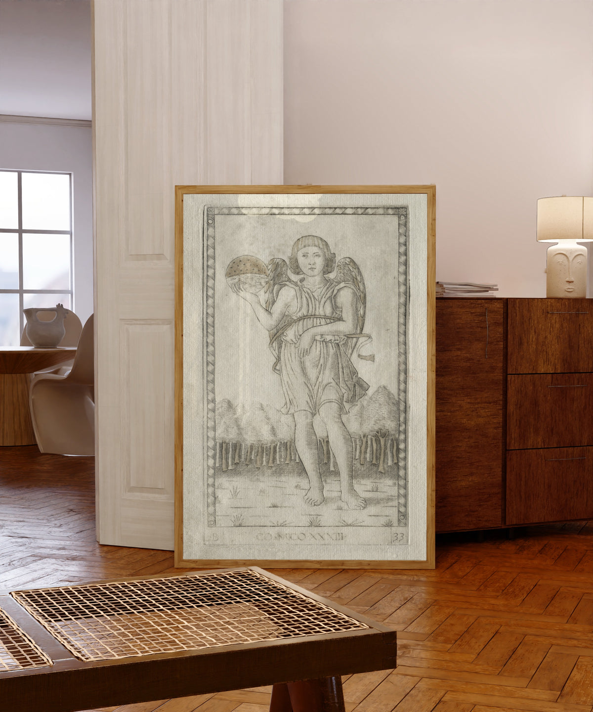Framed art print of Genius of the World (from the… by Master of the E-Series Tarocchi, in a light wood frame leaning in a warm room with a parquet floor