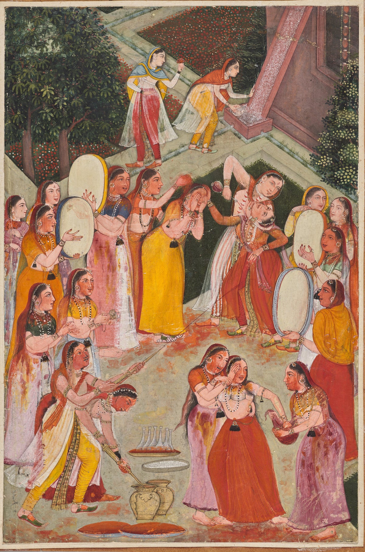 Girls Spraying Each Other at Holi by Bikaner school — Women drum and soak each other in colour in a garden