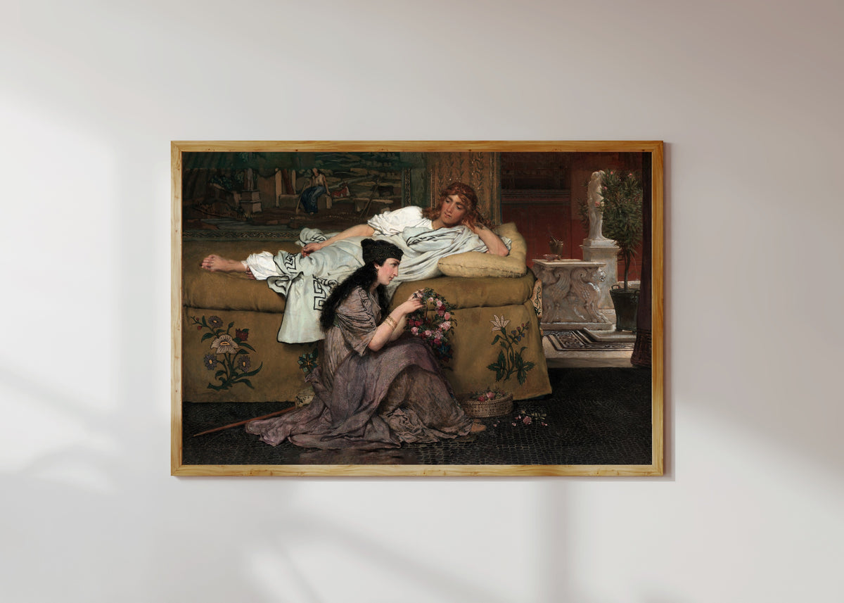 Framed art print of Glaucus and Nydia by Lawrence Alma-Tadema, in a light wood frame on a sunlit white wall