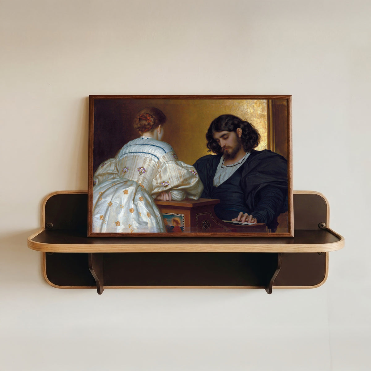 Framed art print of Golden Hours by Frederic Leighton, in a dark wood frame resting on a wall shelf