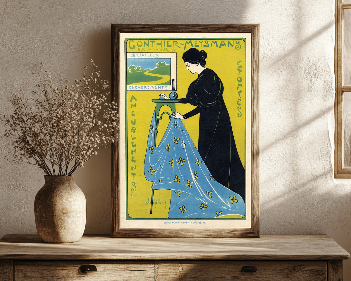 Framed art print of Gonthier-Meysmans, Rue de Namur 67, Bruxelles by Henri Meunier, in a dark wood frame leaning on a rustic console beside dried flowers