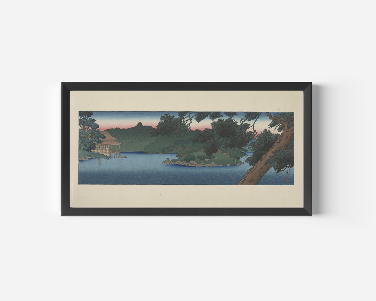 Framed art print of Guest House in the Pines, Mitsubishi Villa at Fukagawa by Kawase Hasui, in a wide black frame on a plain white wall