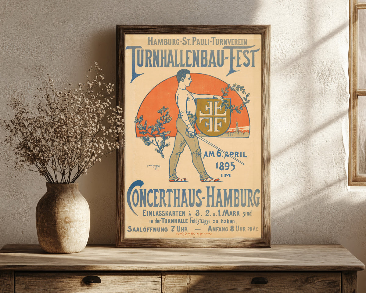 Framed art print of Hamburg-St. Pauli Turnverein: Turnhallenbau-Fest by Hans Christiansen, in a dark wood frame leaning on a rustic console beside dried flowers