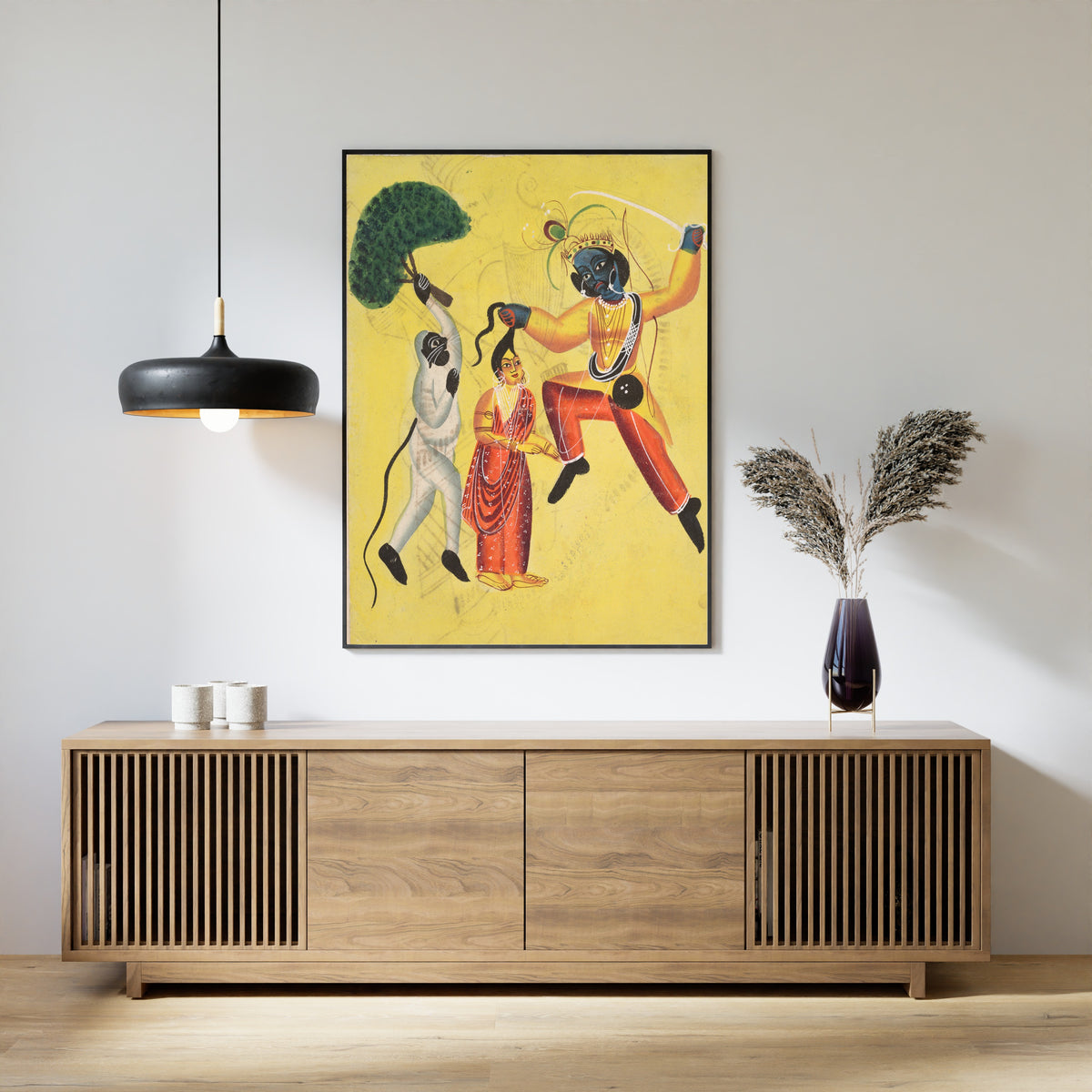 Framed art print of Hanuman Attacks Indrajit Holding an Apparition of Sita by the Hair by Kalighat painter, above a slatted wood sideboard