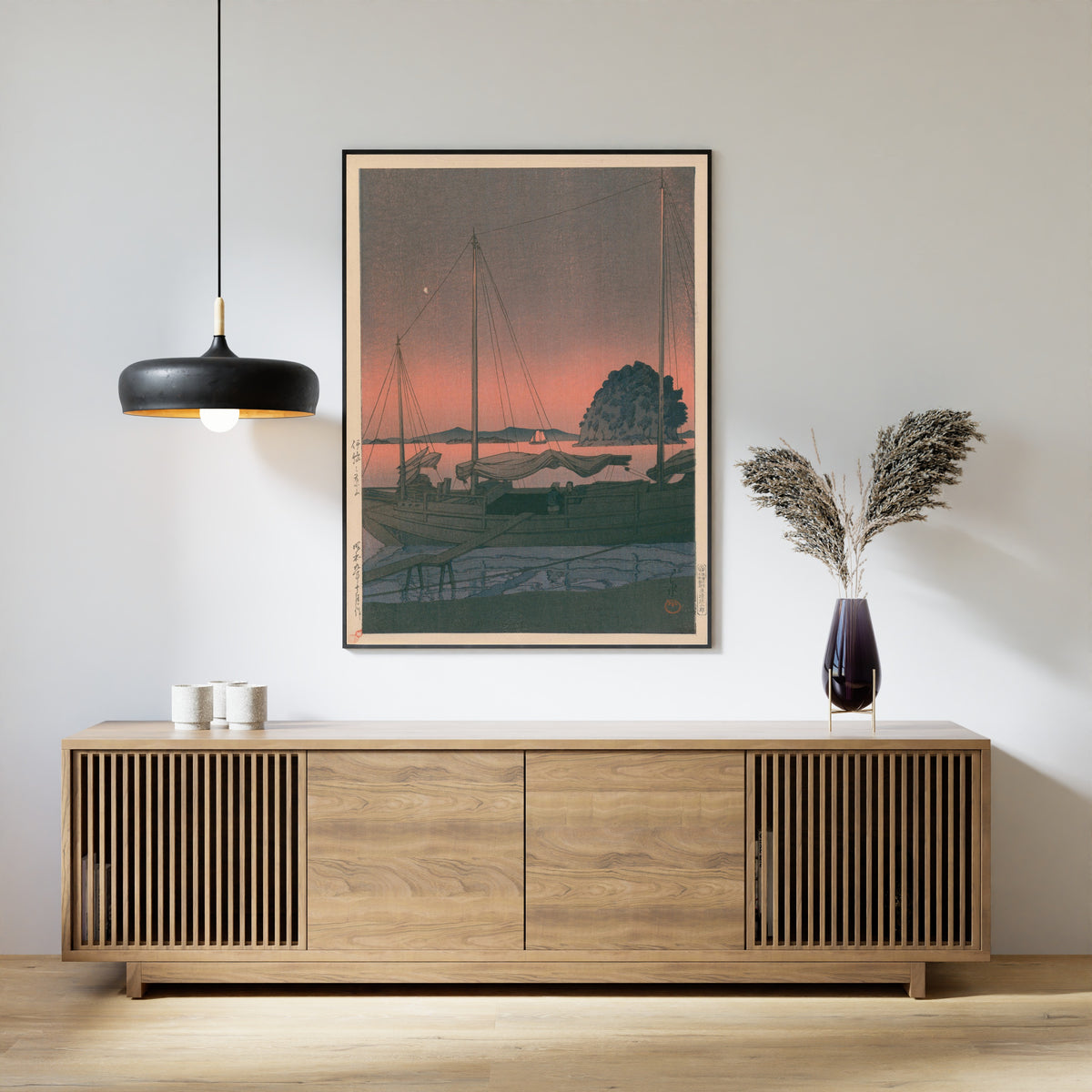 Framed art print of Hayama in Iyo by Kawase Hasui, above a slatted wood sideboard