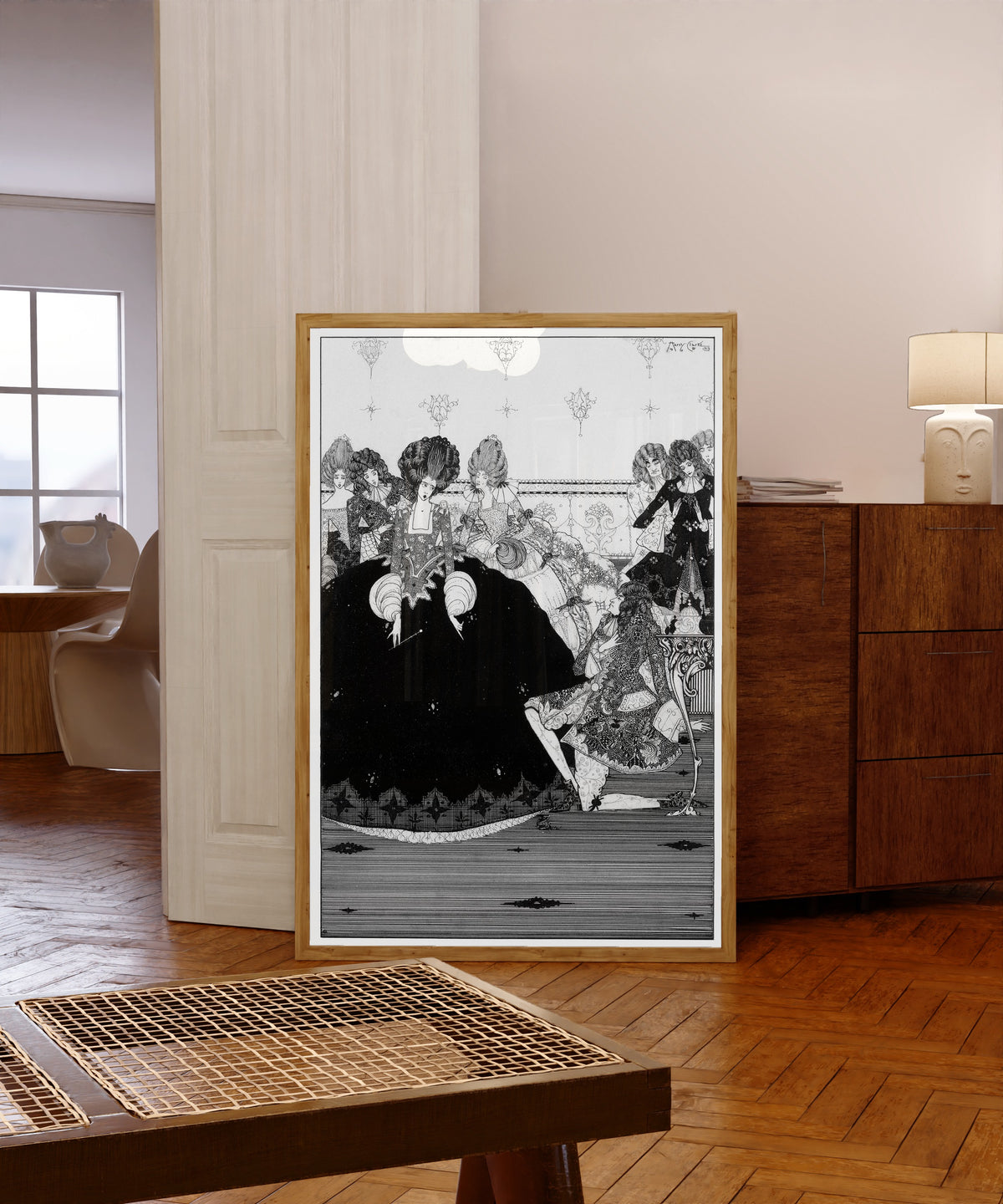 Framed art print of He Takes the Gift with Reverence and Extends by Harry Clarke, in a light wood frame leaning in a warm room with a parquet floor