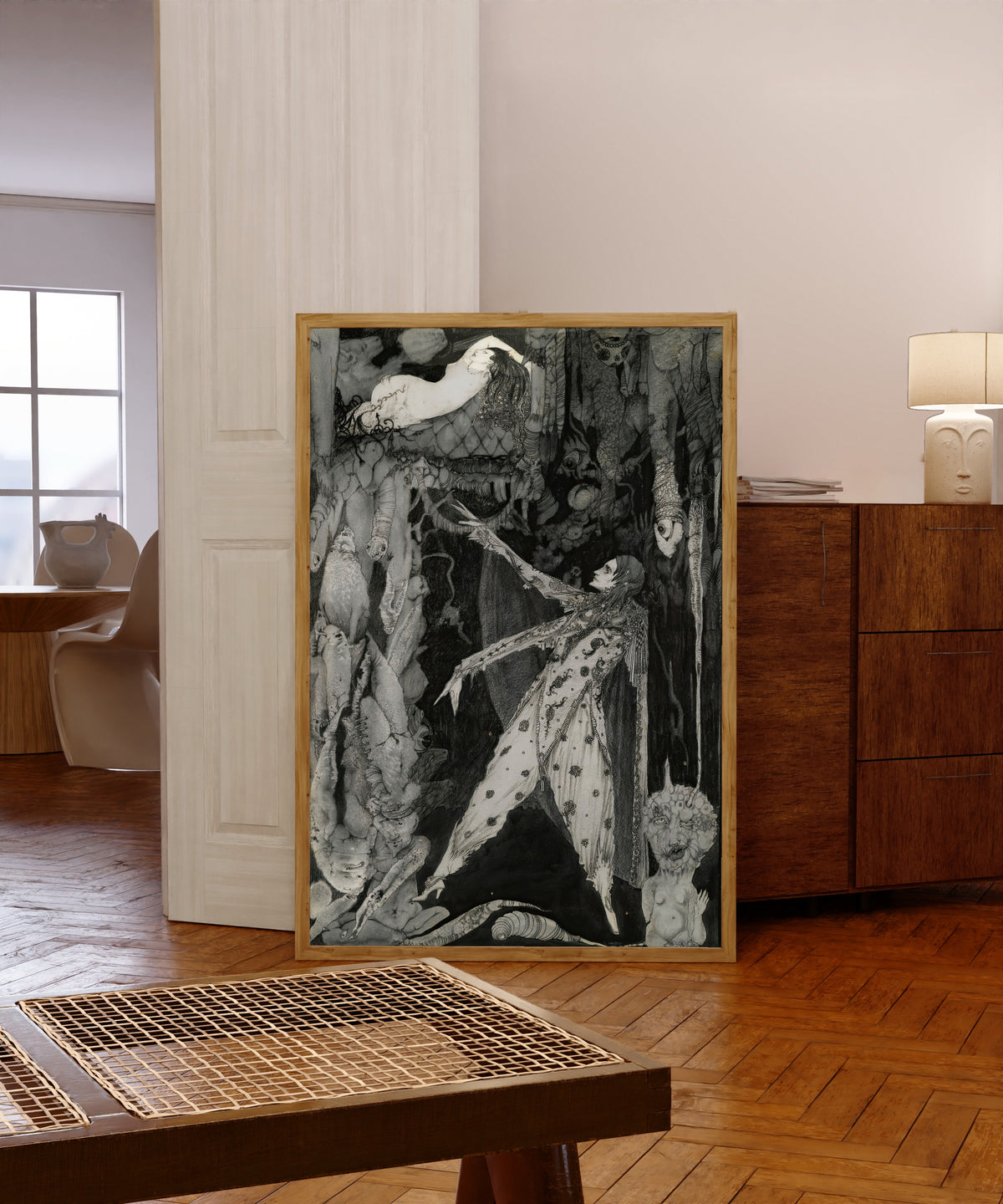Framed art print of How Heavenly Fair by Harry Clarke, in a light wood frame leaning in a warm room with a parquet floor
