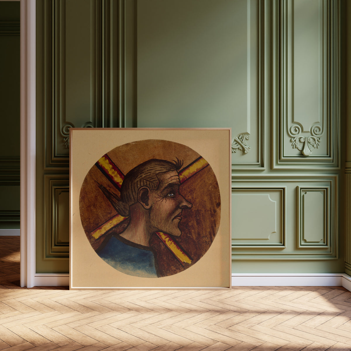 Framed art print of Hulluus by Hugo Simberg, leaning against olive-green panelling on a herringbone floor