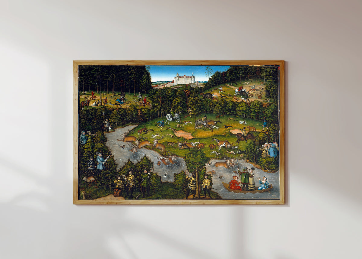 Framed art print of Hunting near Hartenfels Castle by Lucas Cranach the Elder, in a light wood frame on a sunlit white wall