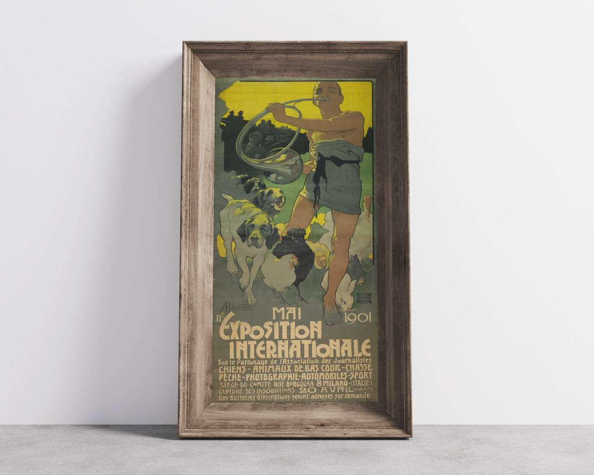 Framed art print of IIe Exposition Internationale, Mai 1901 by Adolfo Hohenstein, in a wide wooden frame leaning against a concrete wall