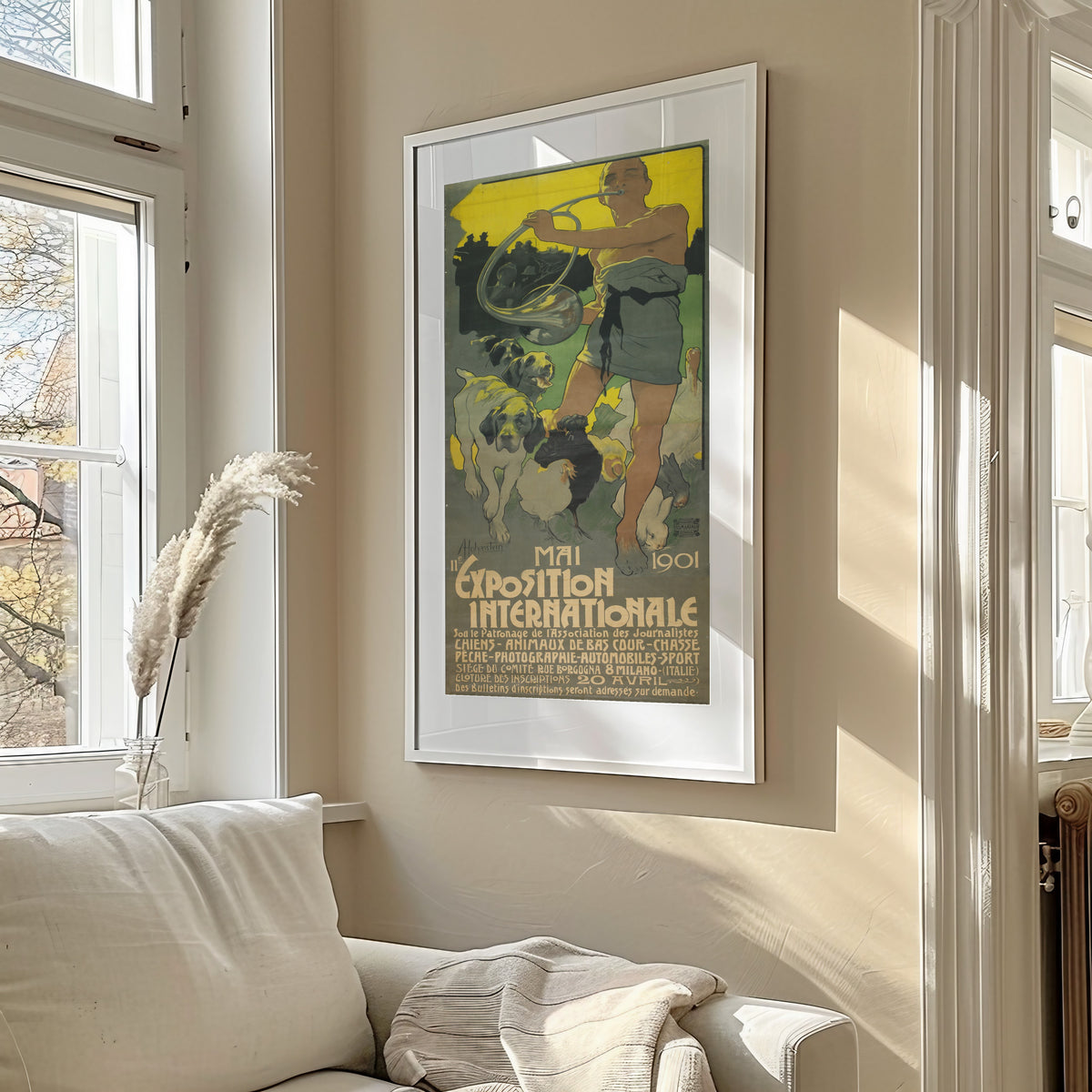 Framed art print of IIe Exposition Internationale, Mai 1901 by Adolfo Hohenstein, in a sunlit living room above a sofa