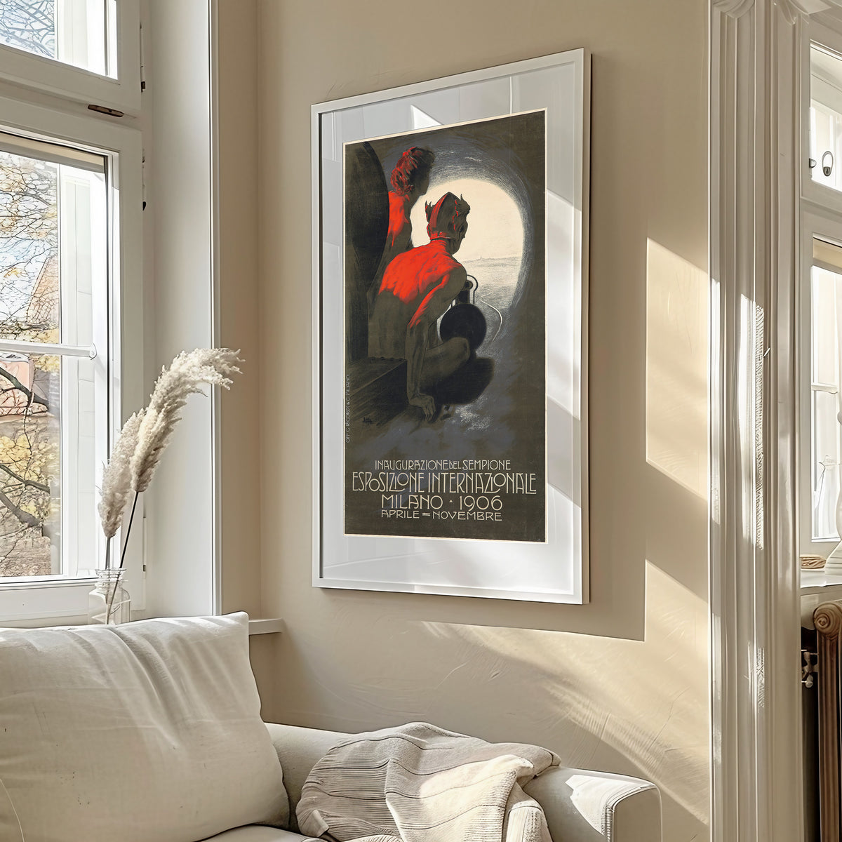 Framed art print of Inaugurazione del Sempione: Esposizione Internazionale, Milano 1906 by Leopoldo Metlicovitz, in a sunlit living room above a sofa