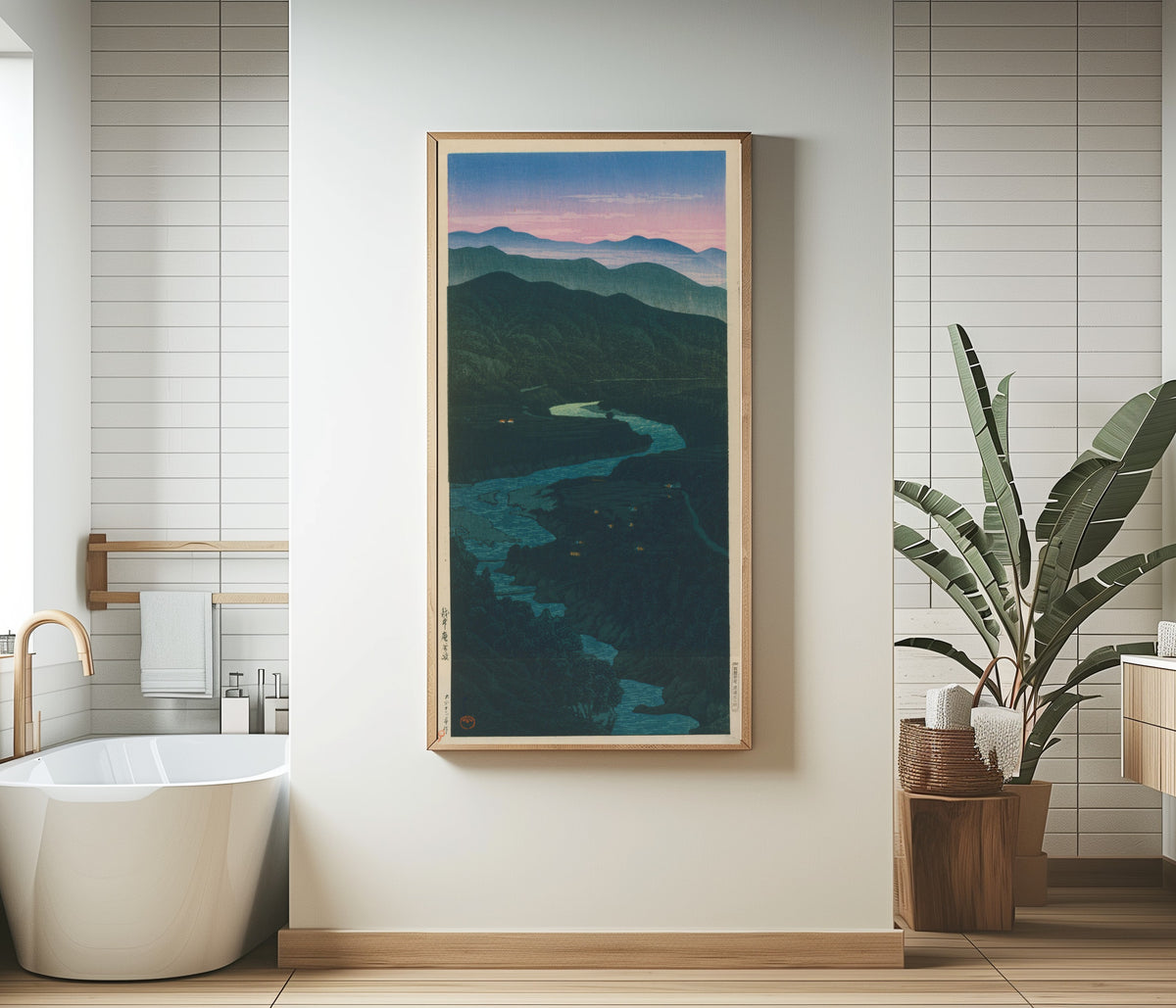 Framed art print of Ioridani Pass, Etchu by Kawase Hasui, in a bathroom beside a freestanding tub
