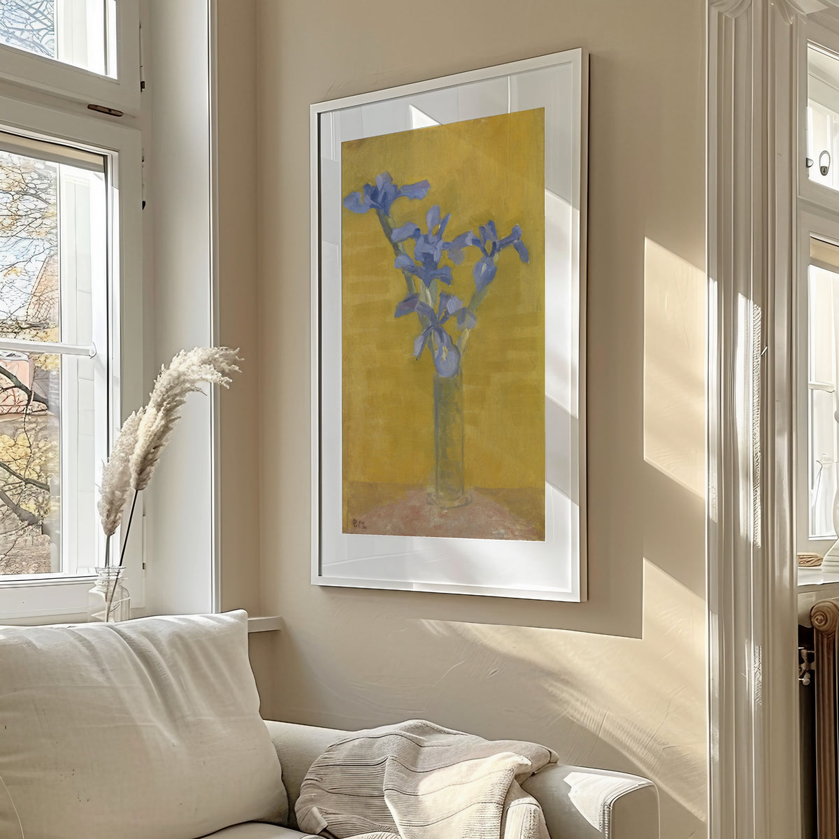 Framed art print of Irises by Piet Mondrian, in a sunlit living room above a sofa