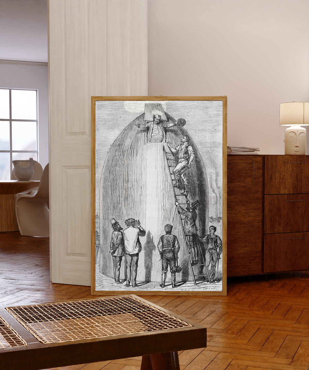 Framed art print of J.-T. Maston avait engraissé! (J.-T. Maston had put… by Henri de Montaut, in a light wood frame leaning in a warm room with a parquet floor