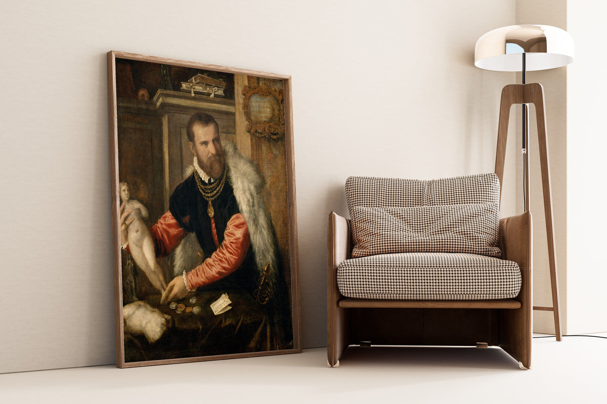Framed art print of Jacopo Strada by Titian, leaning against a wall beside an armchair and a floor lamp