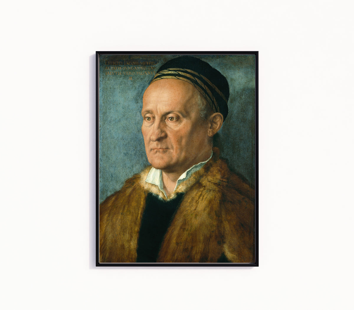Framed art print of Jakob Muffel by Albrecht Dürer, in a slim black frame on a plain white wall