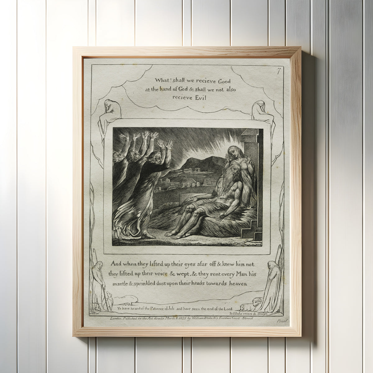 Framed art print of Job's Comforters (Book of Job, Plate 7) by William Blake, in a light wood frame on a white panelled wall