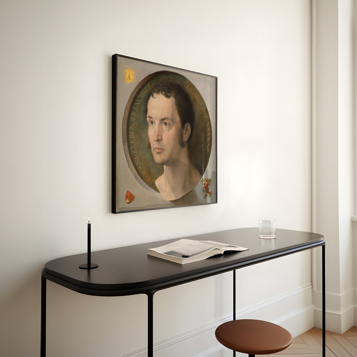 Framed art print of Johannes Kleberger by Albrecht Dürer, above a slim black console table