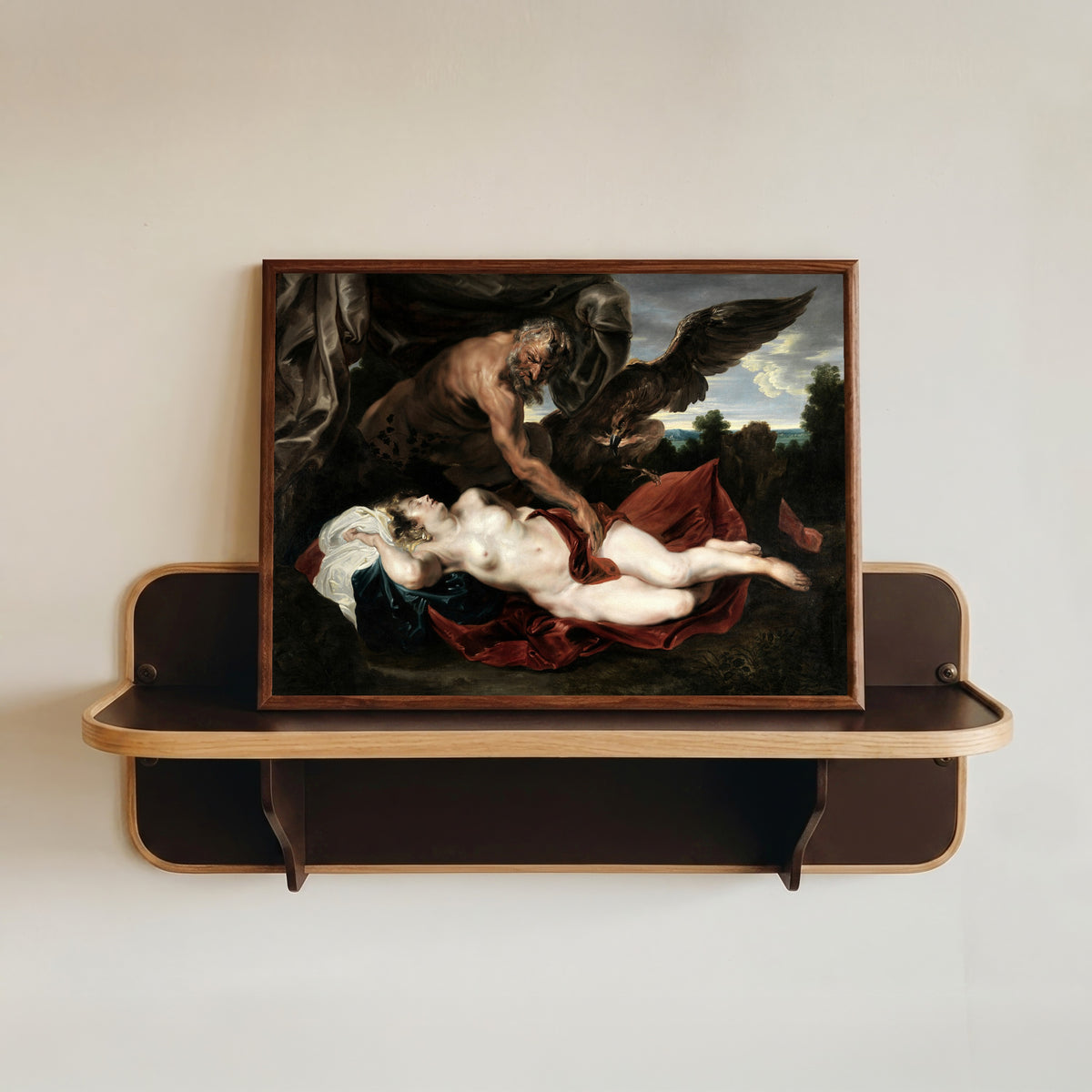 Framed art print of Jupiter and Antiope by Anthony van Dyck, in a dark wood frame resting on a wall shelf