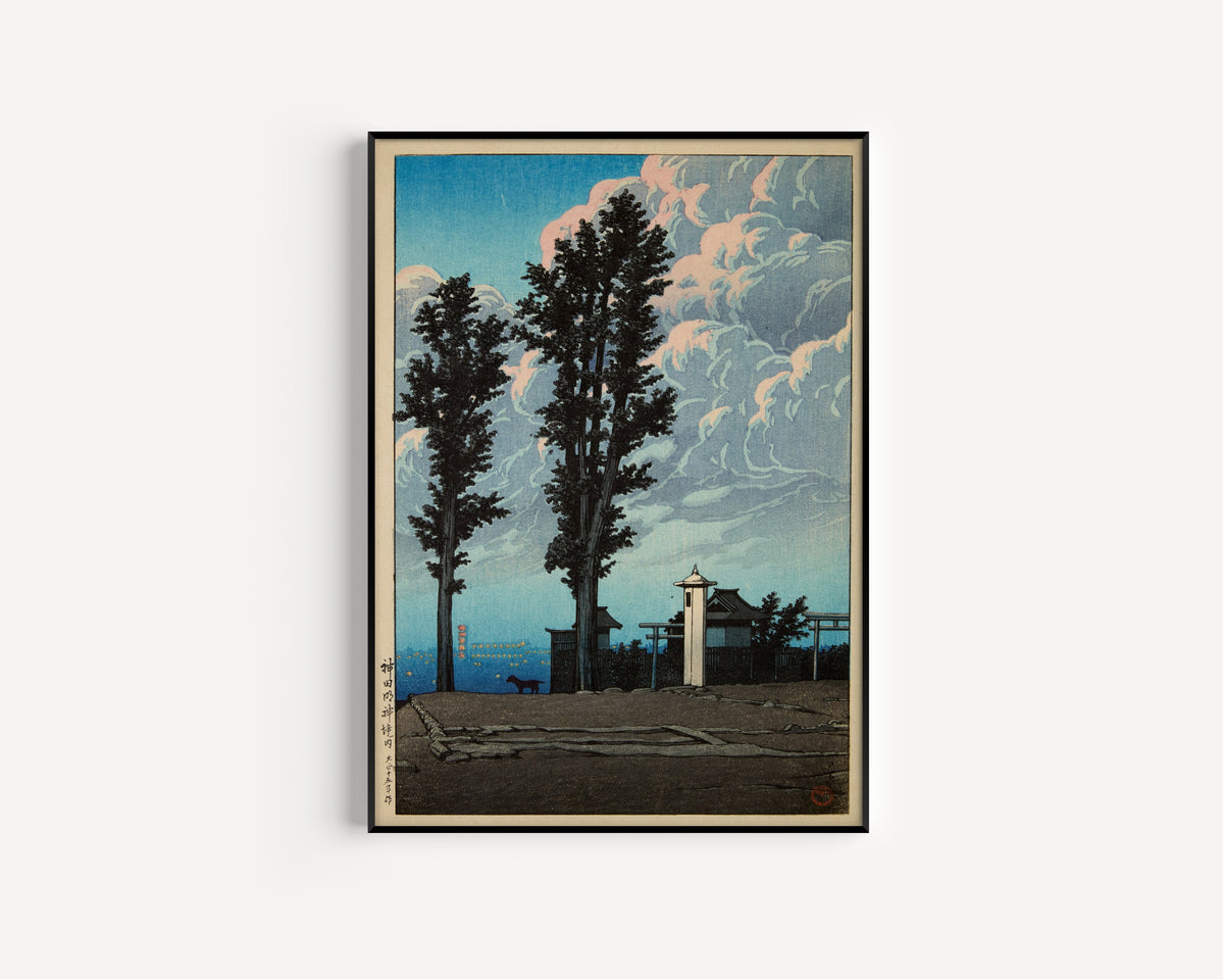 Framed art print of Kanda Myojin Shrine Precinct by Kawase Hasui, in a slim black frame on a plain white wall