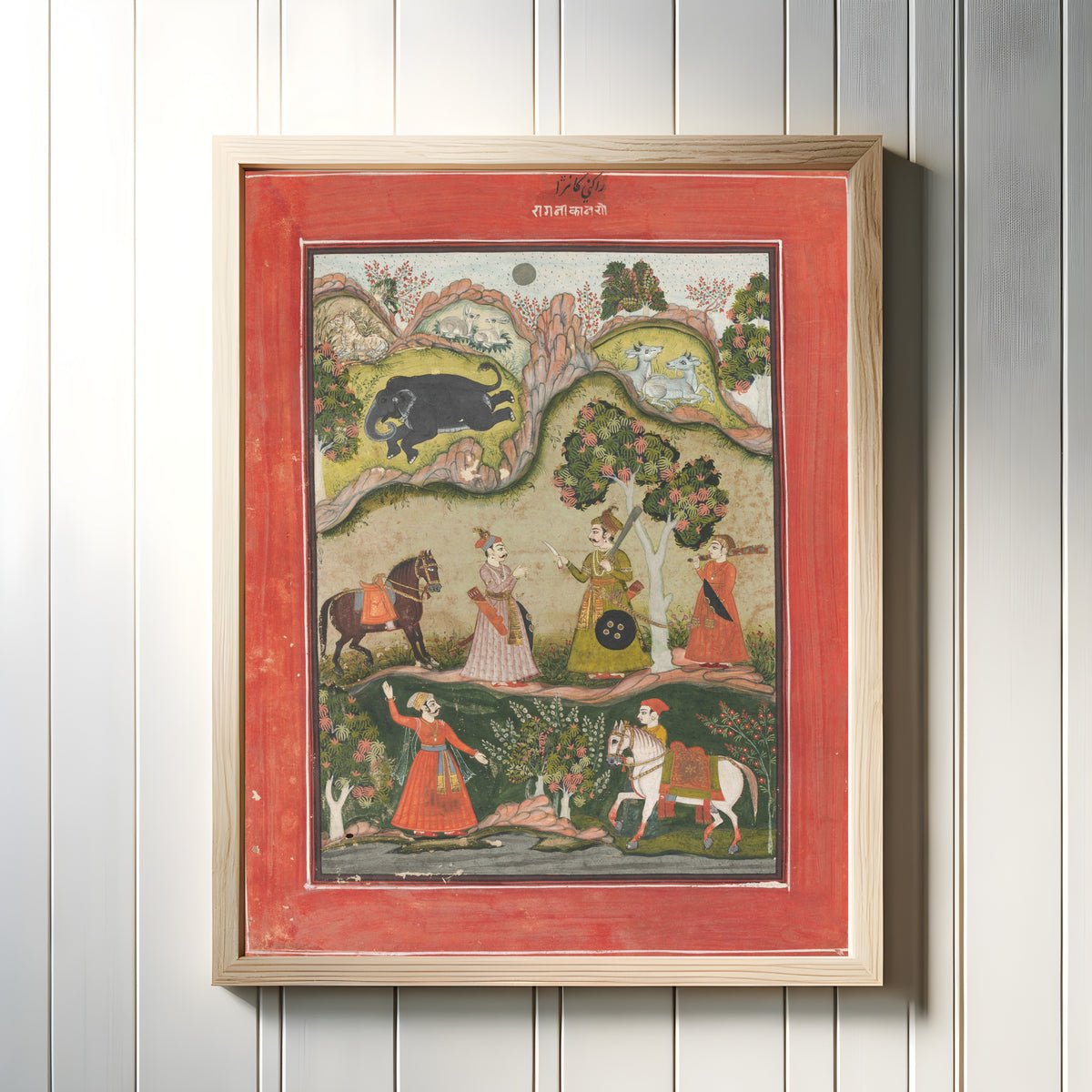 Framed art print of Kanhara Ragini: Song of Inspiration to Krishna for Killing the… by Bundi or Kota school, in a light wood frame on a white panelled wall
