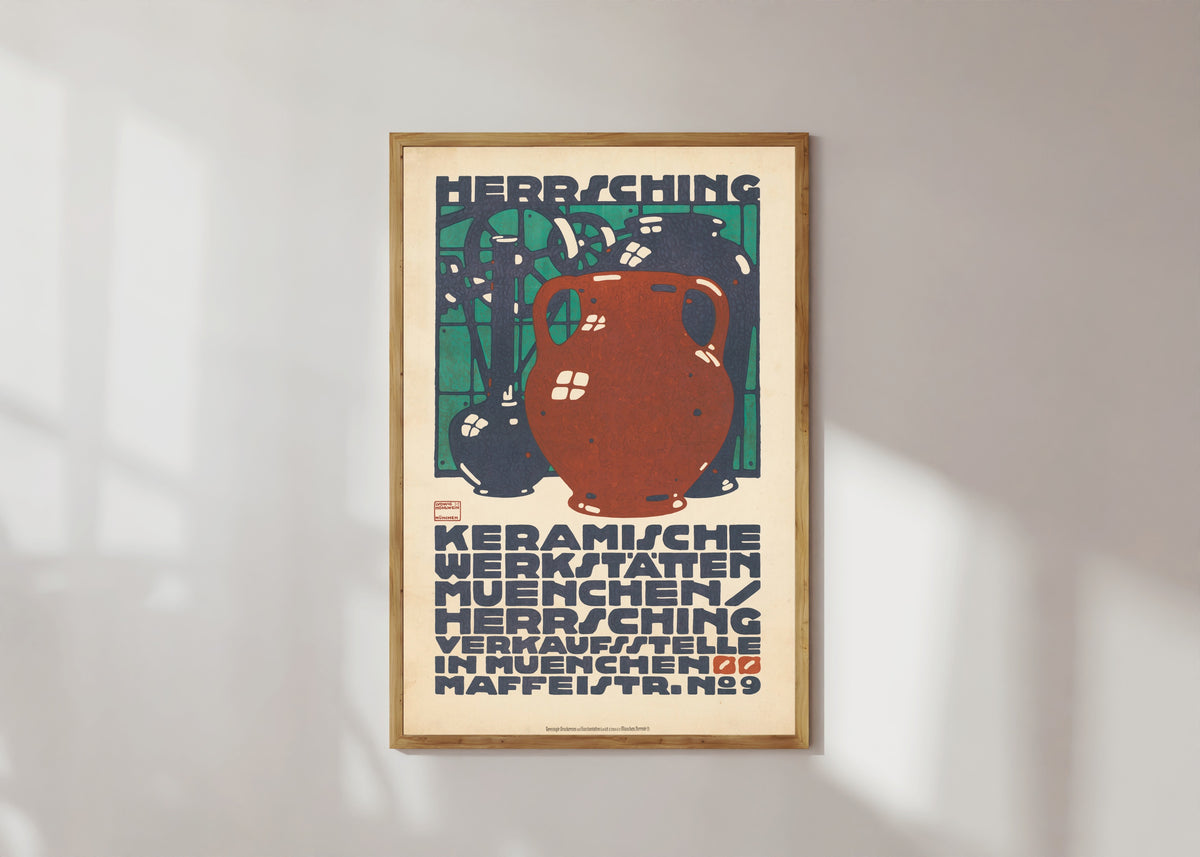 Framed art print of Keramische Werkstätten München: Herrsching by Ludwig Hohlwein, in a light wood frame on a sunlit white wall