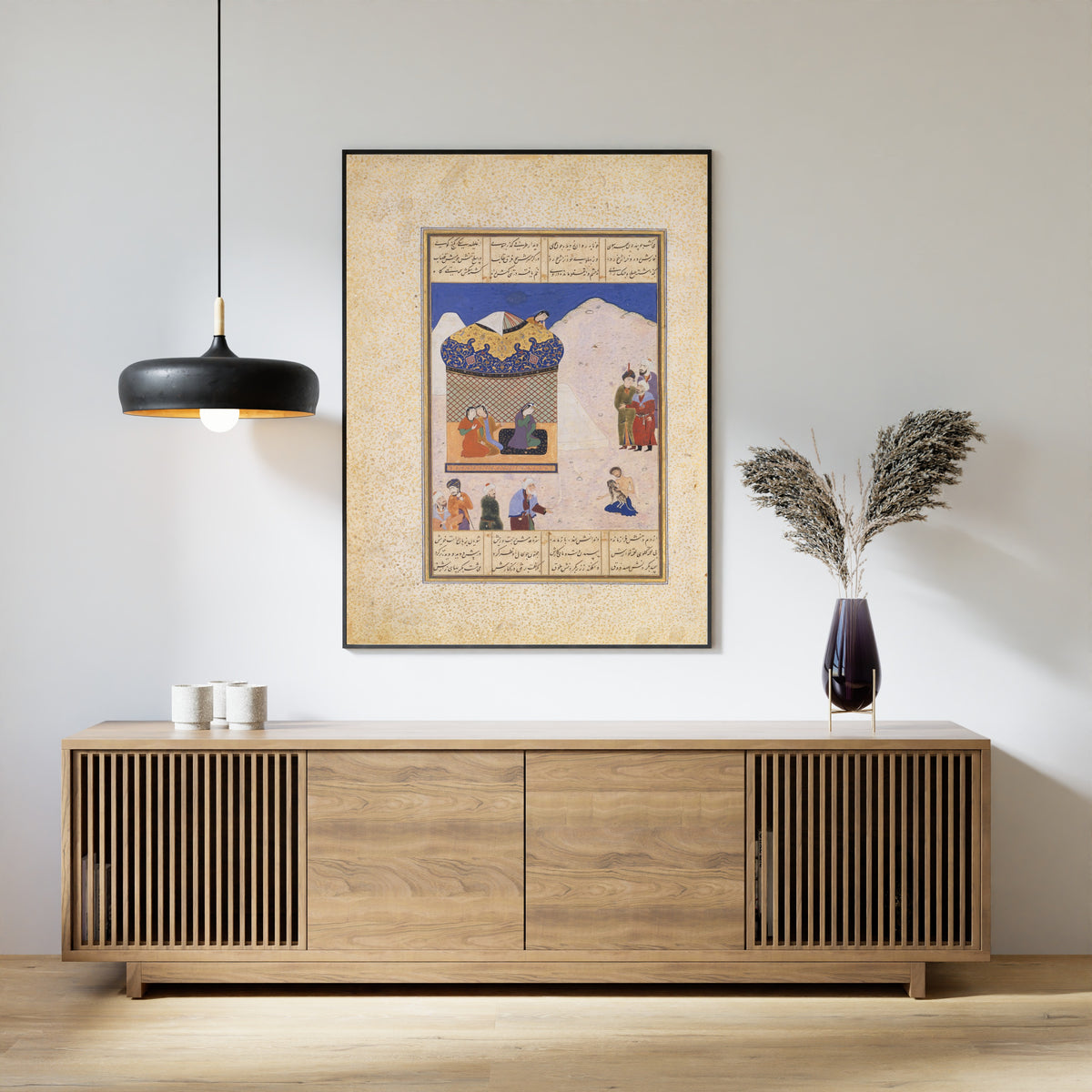 Framed art print of Khamsa of Amir Khusrau Dihlavi: Laila Visiting Majnun in the Desert, above a slatted wood sideboard