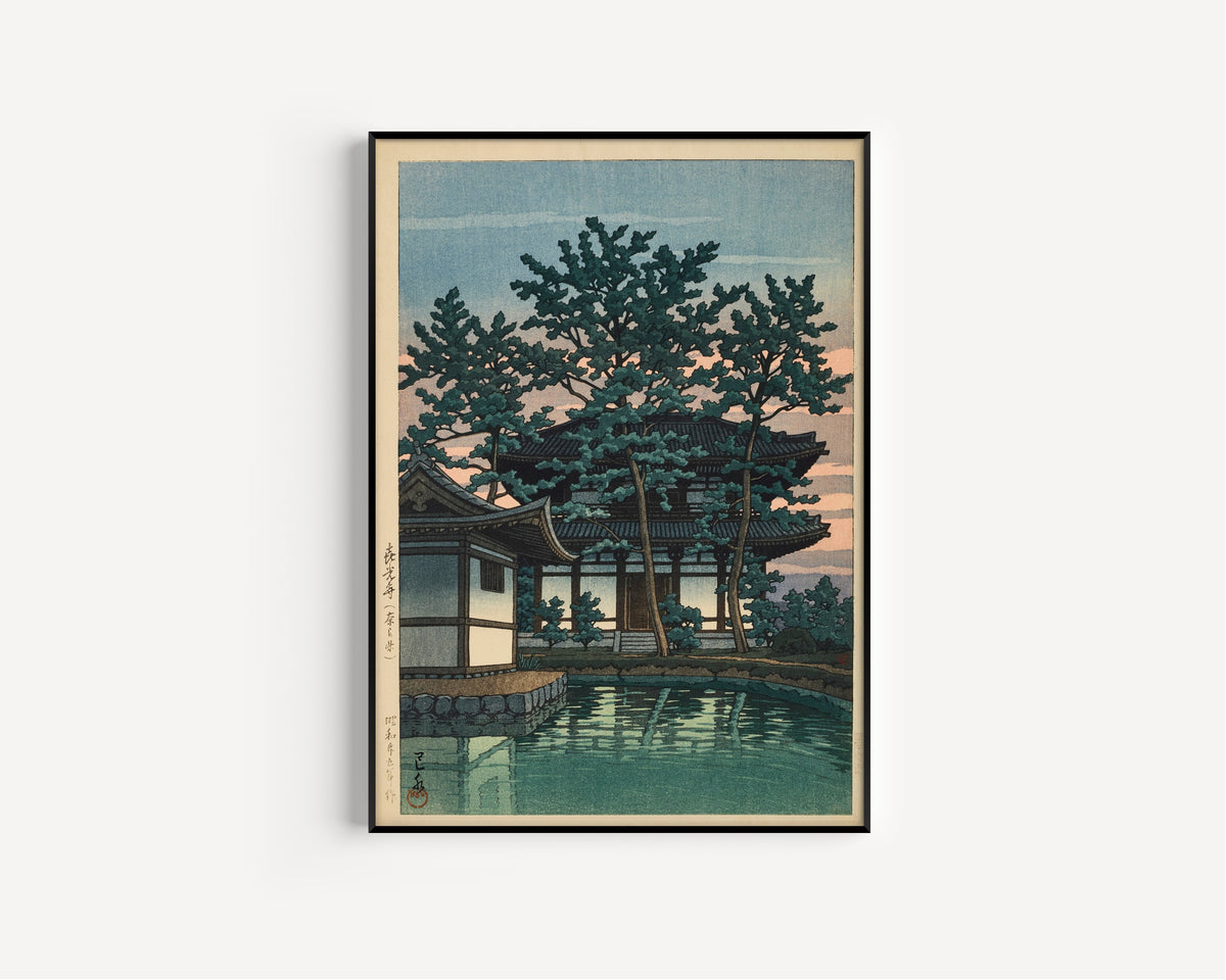 Framed art print of Kiko Temple, Nara Prefecture by Kawase Hasui, in a slim black frame on a plain white wall