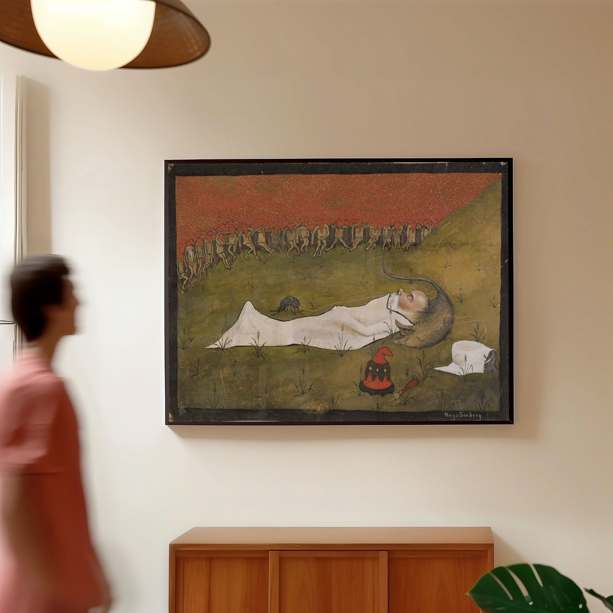 Framed art print of King Hobgoblin Sleeping by Hugo Simberg, in a slim black frame on a warm wall in a sunlit room