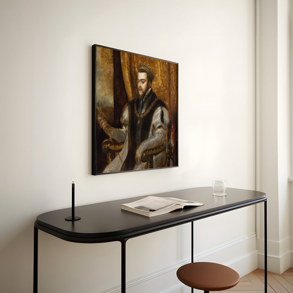 Framed art print of King Philip II of Spain by Titian, above a slim black console table