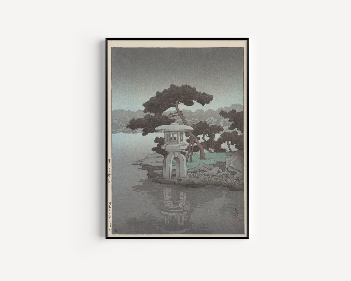 Framed art print of Kiyozumi Garden in Moonlight by Kawase Hasui, in a slim black frame on a plain white wall