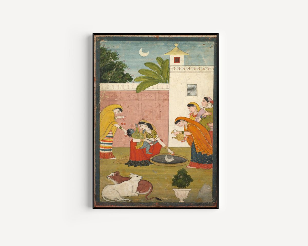 Framed art print of Krishna Reaching for the Moon by Pahari school, in a slim black frame on a plain white wall