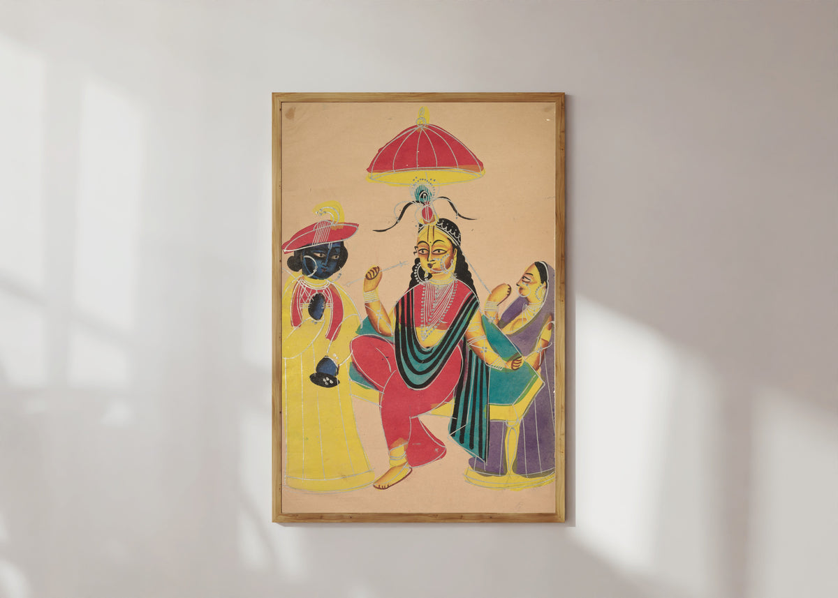 Framed art print of Krishna Standing by Radha who is Seated on a Chair by Kalighat painter, in a light wood frame on a sunlit white wall