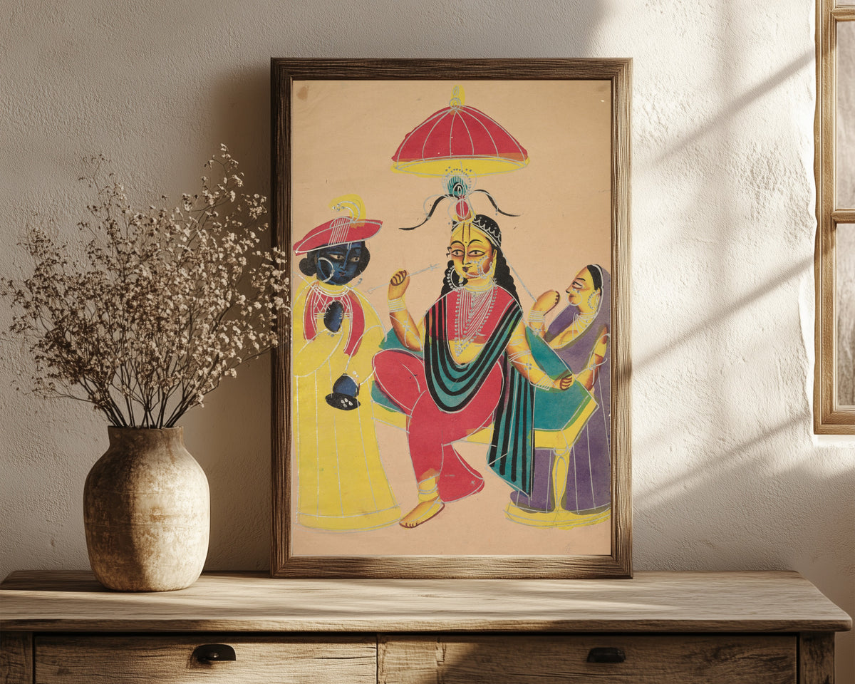 Framed art print of Krishna Standing by Radha who is Seated on a… by Kalighat painter, in a dark wood frame leaning on a rustic console beside dried flowers