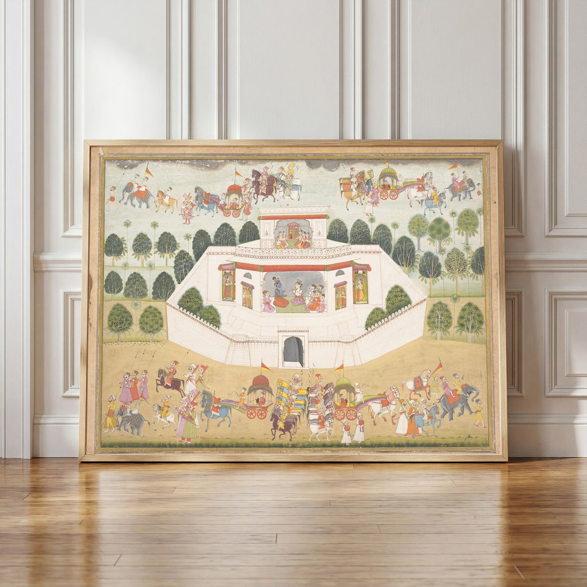Framed art print of Krishna and Balarama within a Walled Palace by Bikaner school, in a light wood frame leaning against a panelled white wall