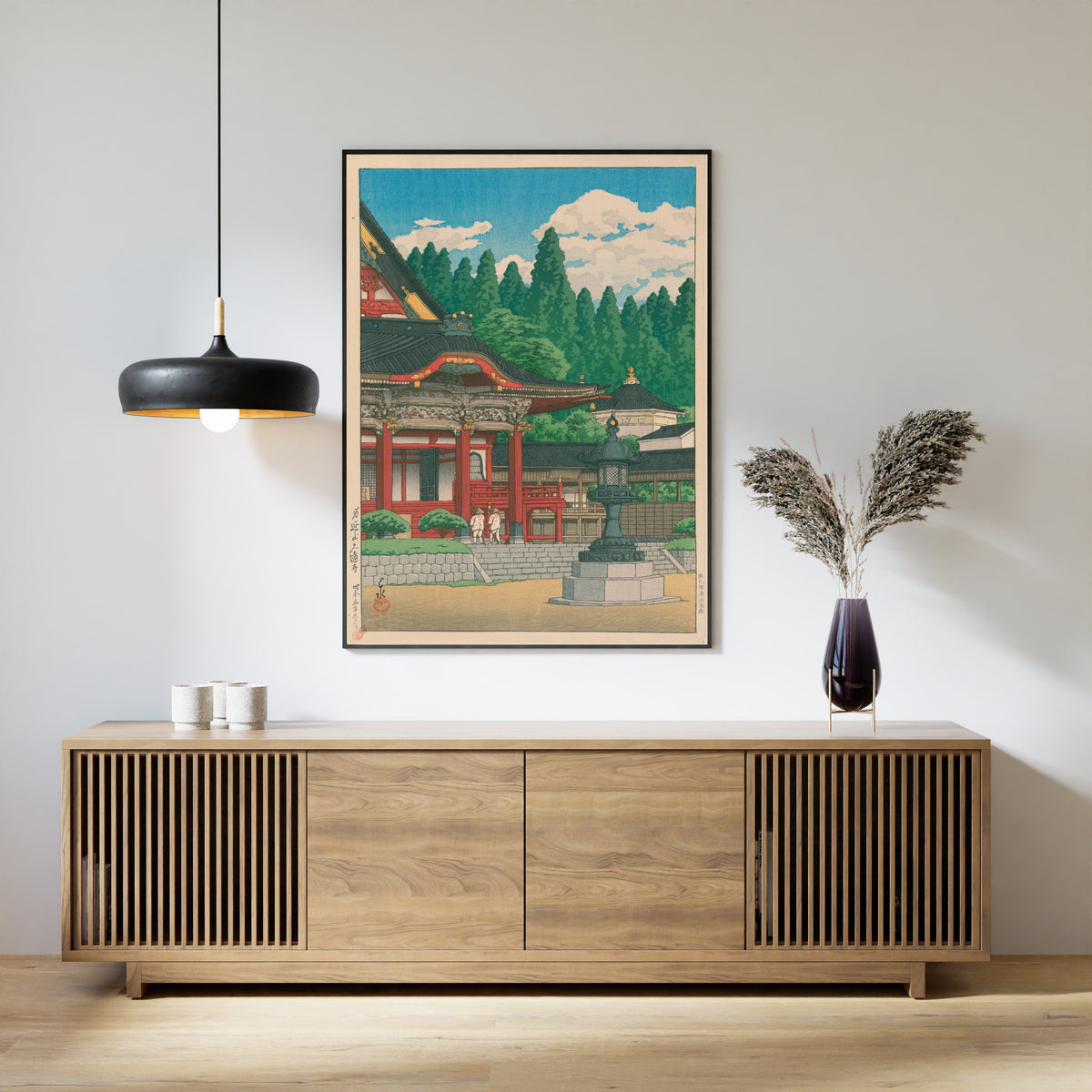 Framed art print of Kuonji Temple at Mount Minobu by Kawase Hasui, above a slatted wood sideboard