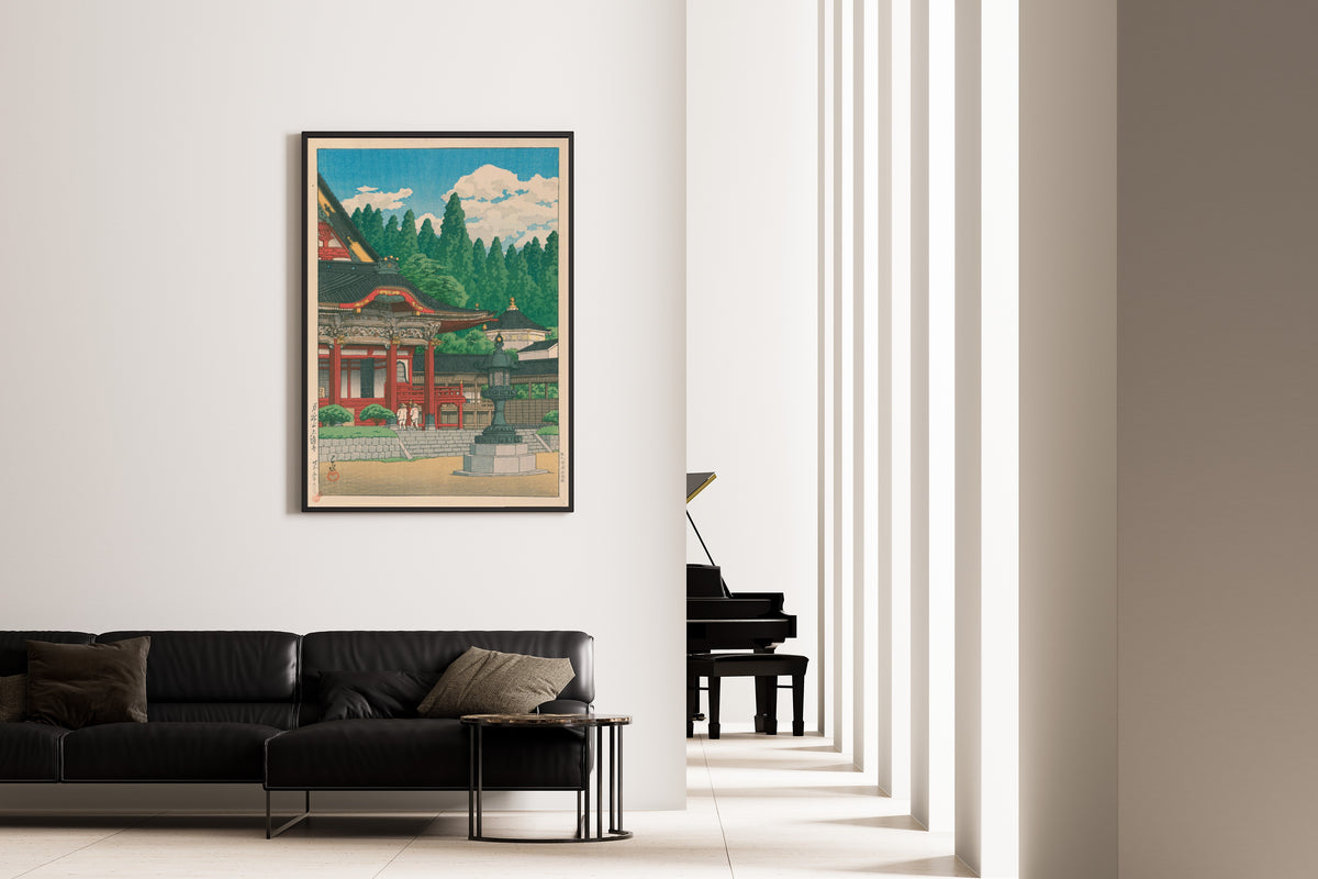 Framed art print of Kuonji Temple at Mount Minobu by Kawase Hasui, on the wall of a minimal living room