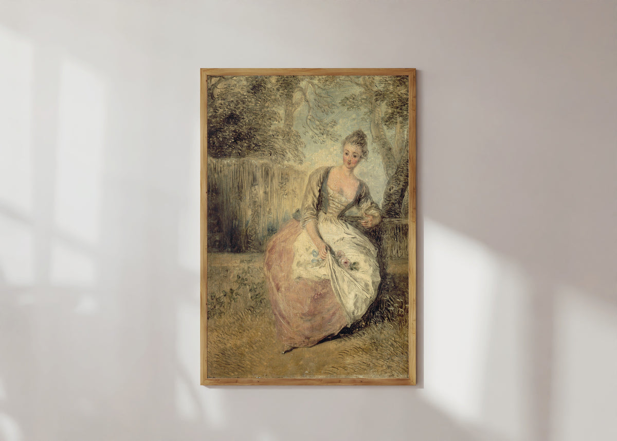 Framed art print of L'Amante inquiète by Jean-Antoine Watteau, in a light wood frame on a sunlit white wall