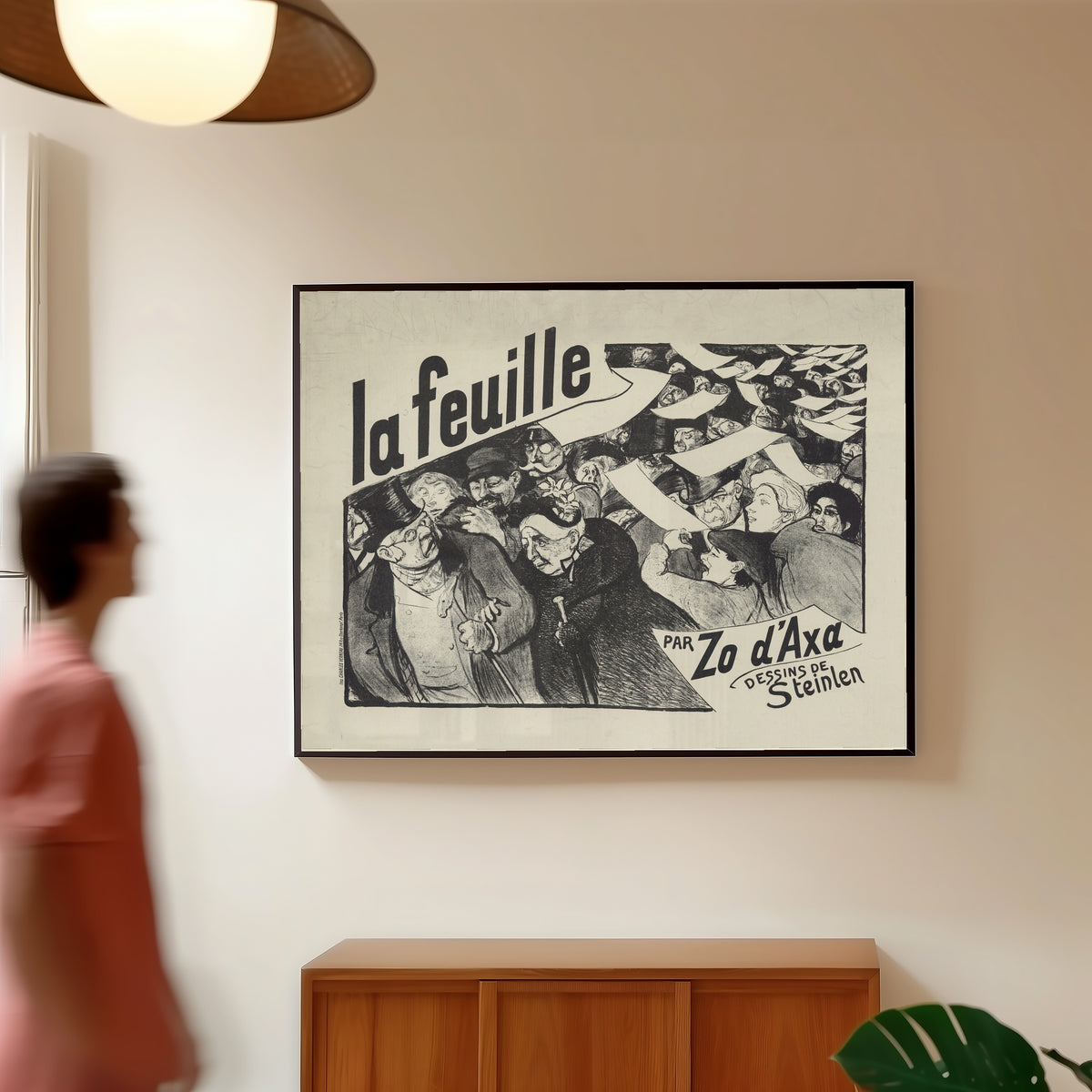 Framed art print of La Feuille, par Zo d’Axa, dessins de Steinlen by Théophile Steinlen, in a slim black frame on a warm wall in a sunlit room