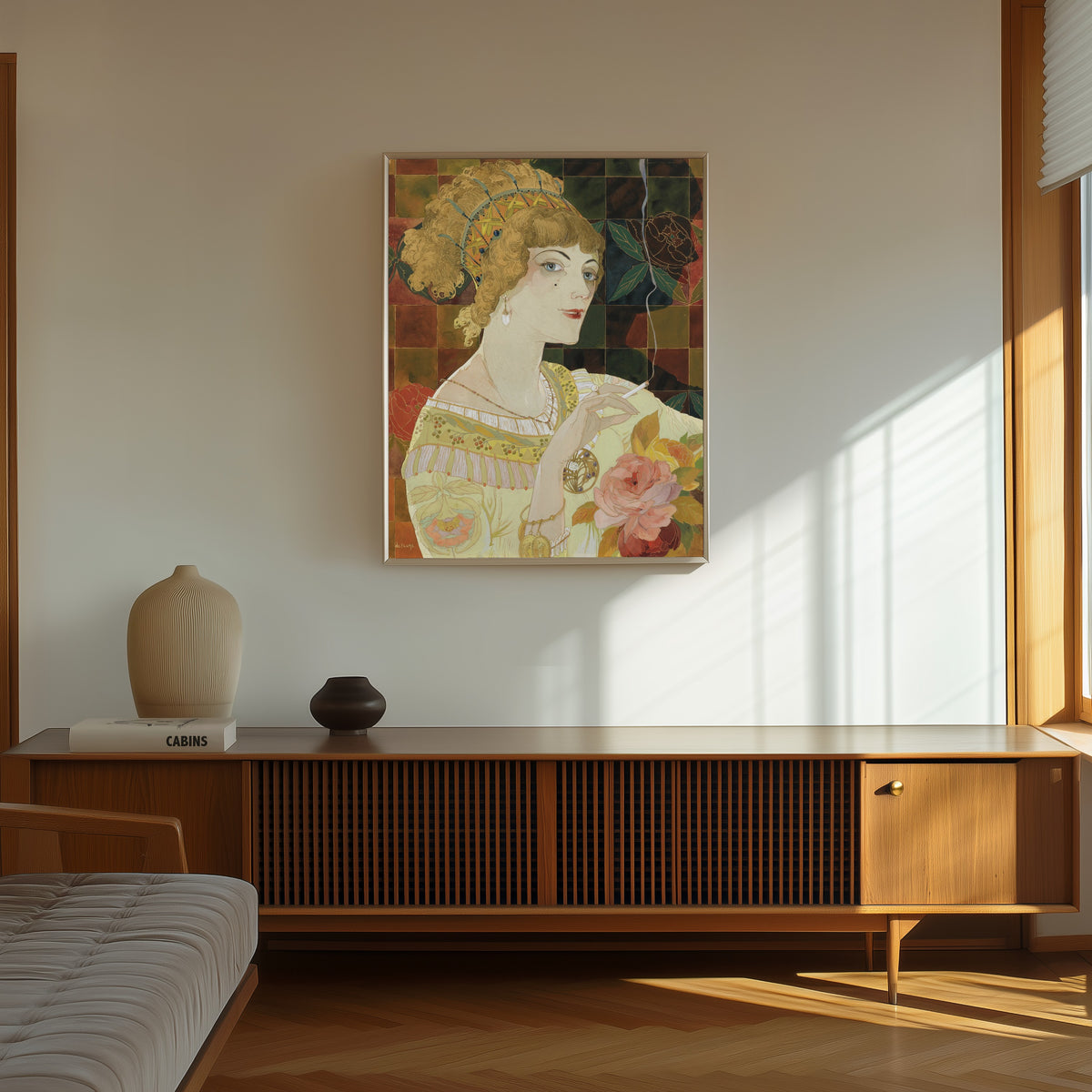 Framed art print of La Fumeuse by Georges de Feure, in a thin light frame on a sunlit wall above a wooden sideboard