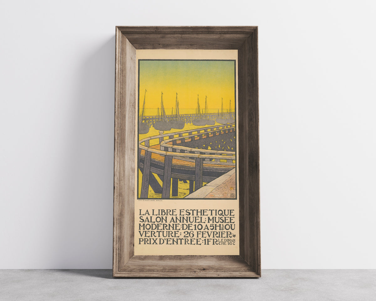 Framed art print of La Libre Esthétique, Salon Annuel (1903) by Gisbert Combaz, in a wide wooden frame leaning against a concrete wall