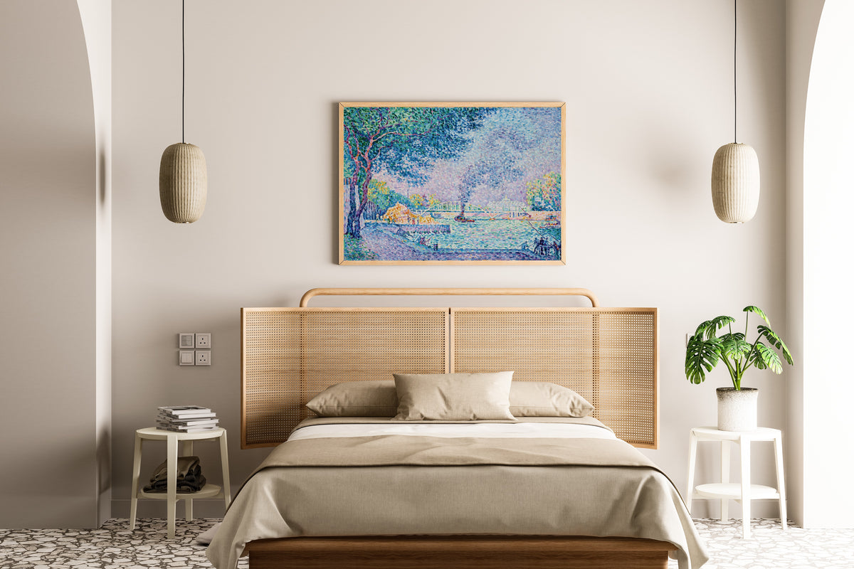 Framed art print of La Passerelle Debilly by Paul Signac, above a cane-headboard bed