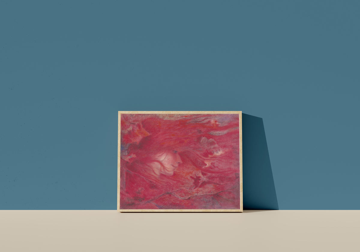 Framed art print of La bourrasque by Lucien Lévy-Dhurmer, in a light wood frame leaning on a blue wall
