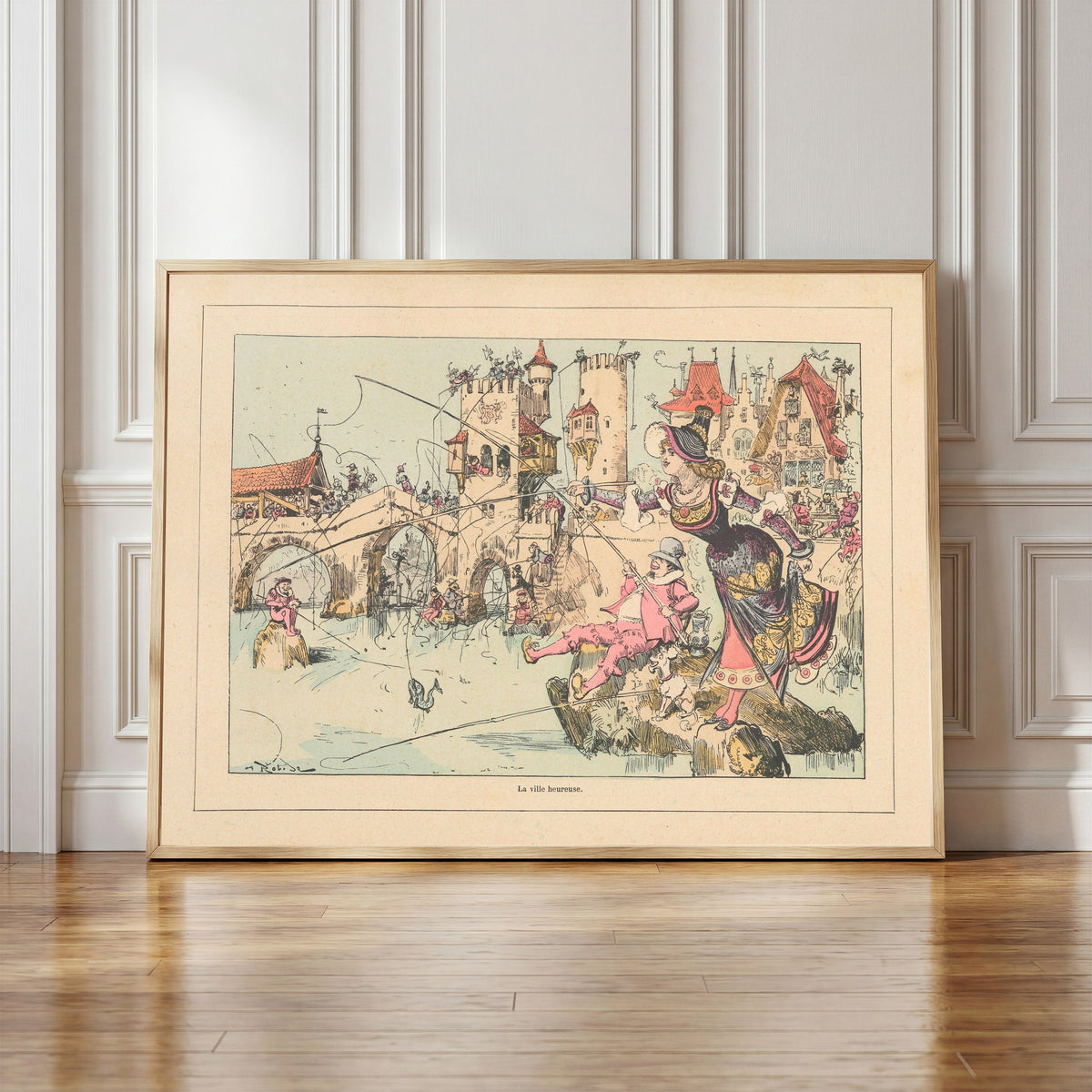Framed art print of La ville heureuse by Albert Robida, in a light wood frame leaning against a panelled white wall