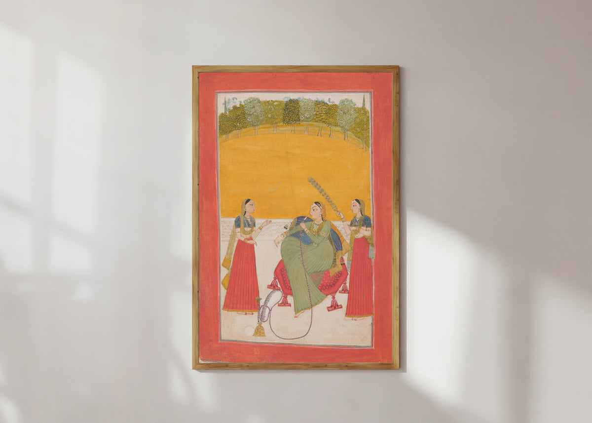 Framed art print of Lady on a Terrace by Chamba school, in a light wood frame on a sunlit white wall