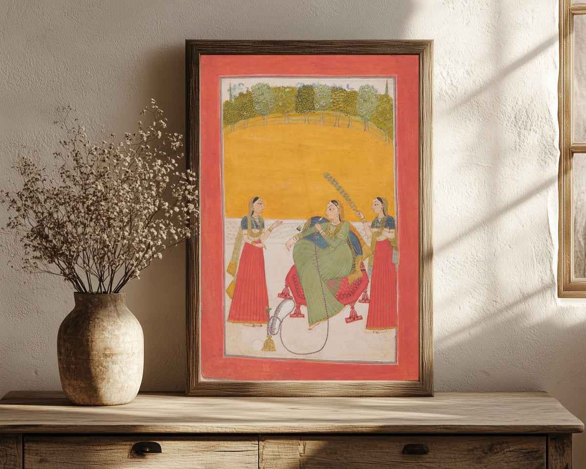 Framed art print of Lady on a Terrace by Chamba school, in a dark wood frame leaning on a rustic console beside dried flowers