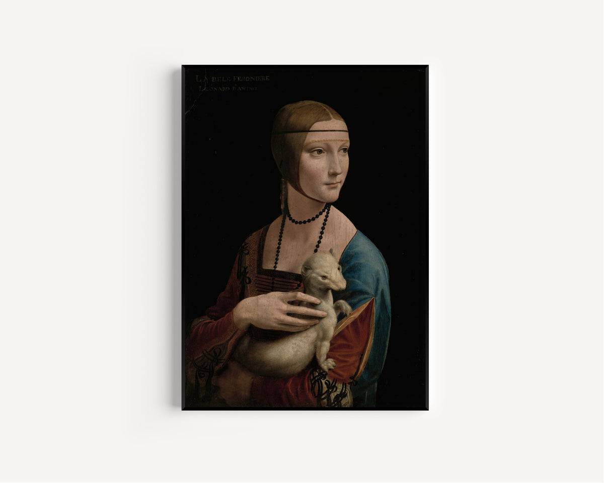 Framed art print of Lady with an Ermine – Portrait of Cecilia Gallerani by Leonardo da Vinci, in a slim black frame on a plain white wall